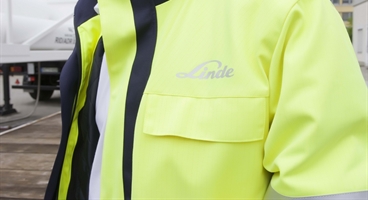 HiQ safety concept - Linde safety coat with gas truck as background - landscape
